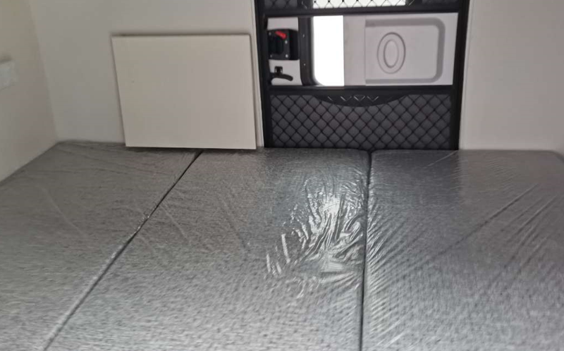 Interior bed space of a custom-built teardrop camper